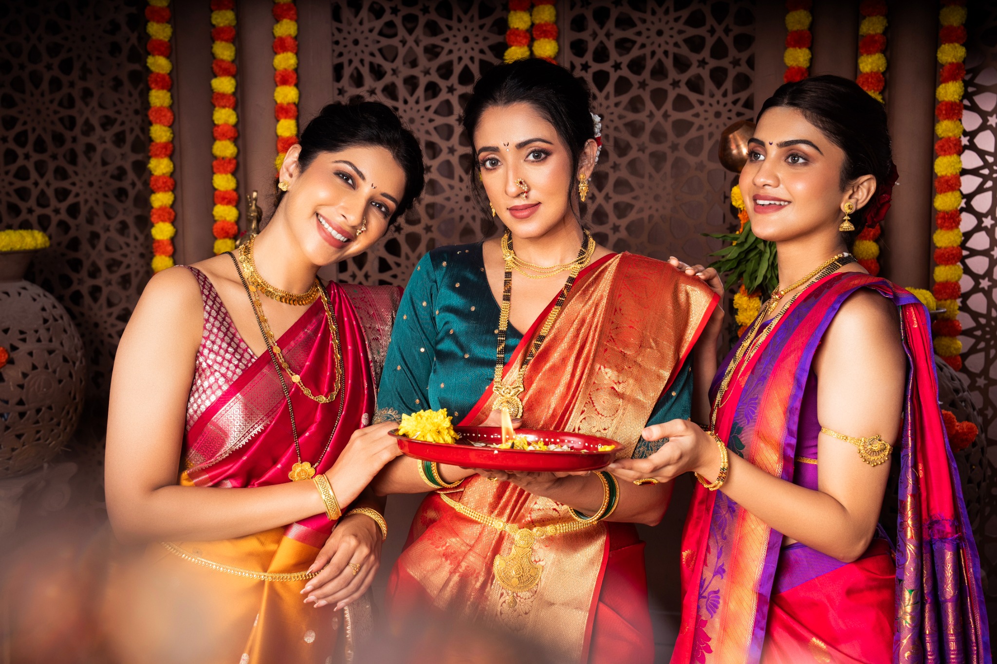 Maharashtrian woman in blue saree wearing gold jewellery