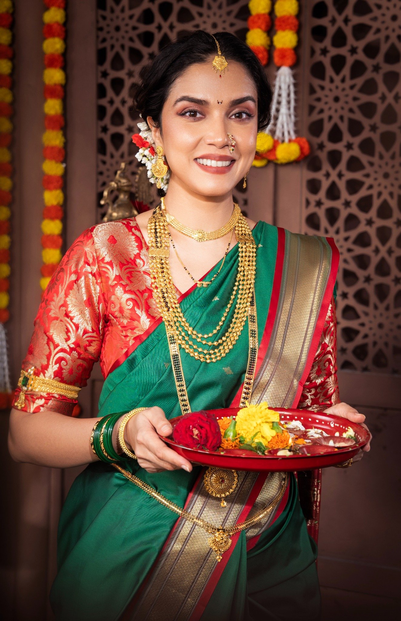 Maharashtrian couple wearing jewellery